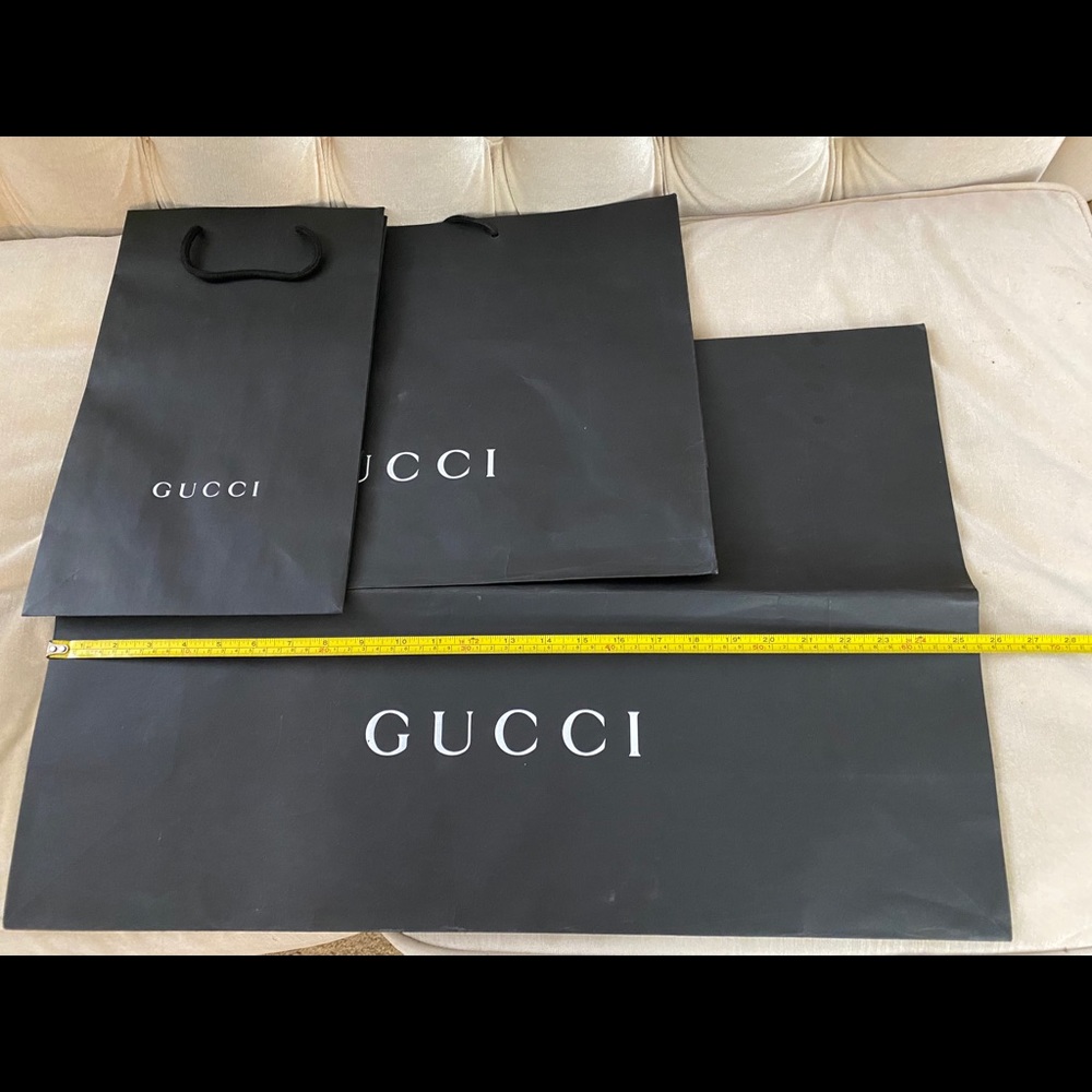 3 Gucci shopping bags